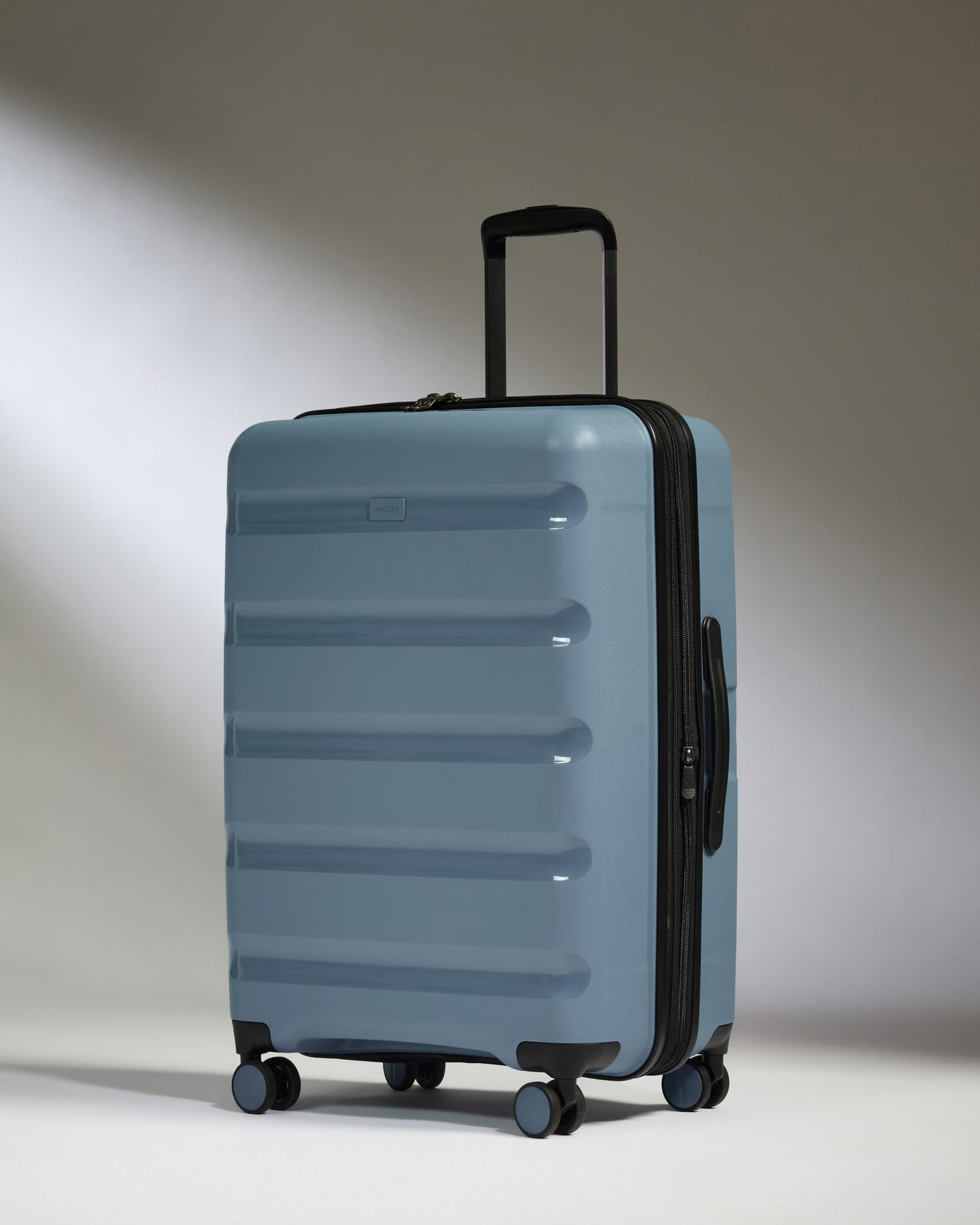 Medium Luggage in Light Blue - Logo Stripe