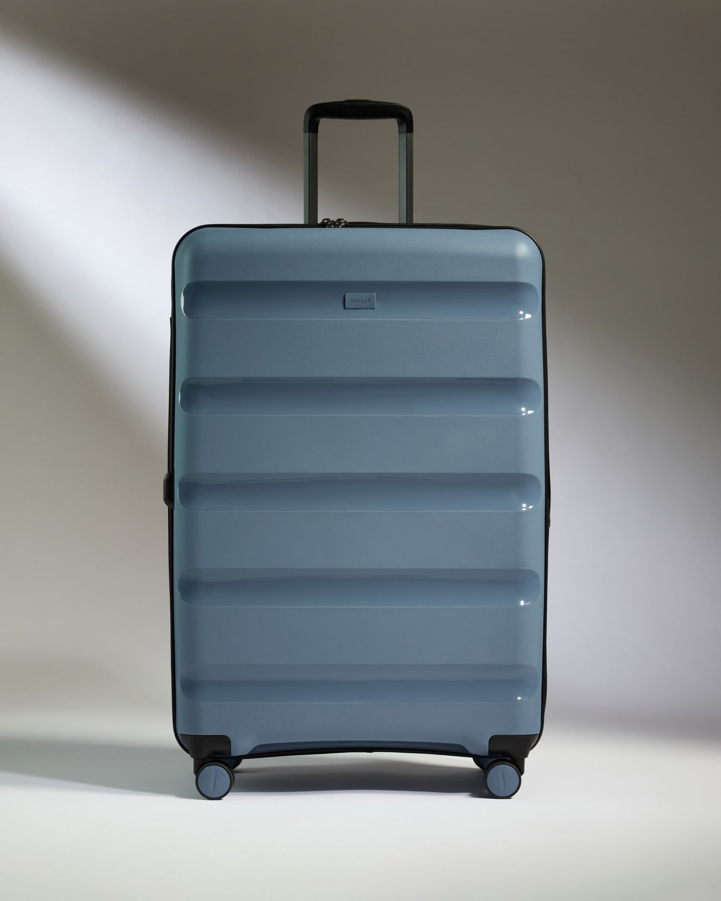 Large Luggage in Light Blue - Logo Stripe