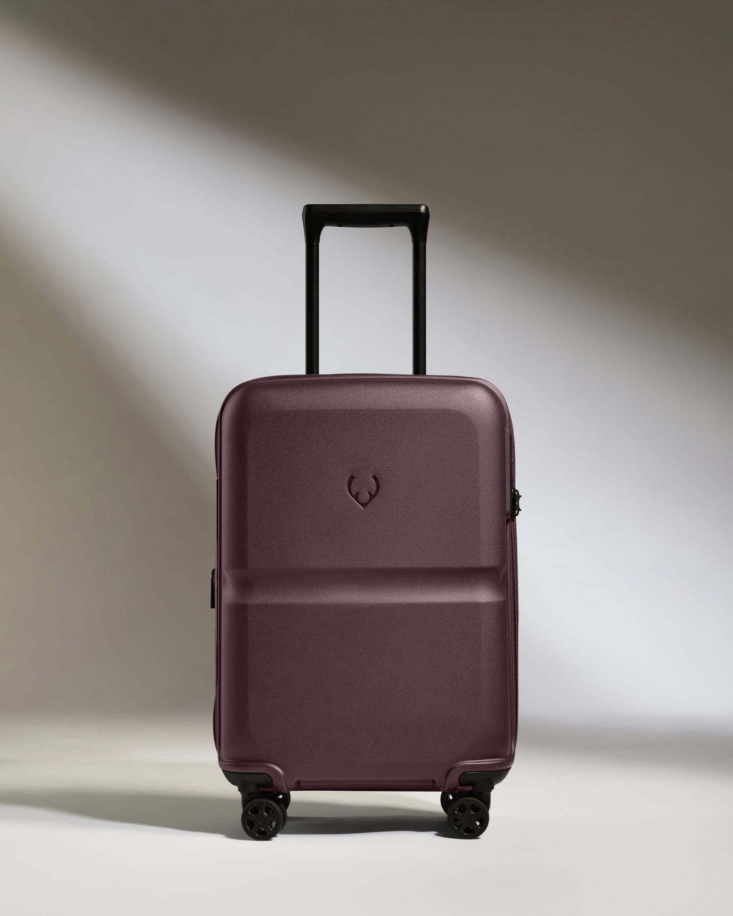 a purple suitcase with wheels