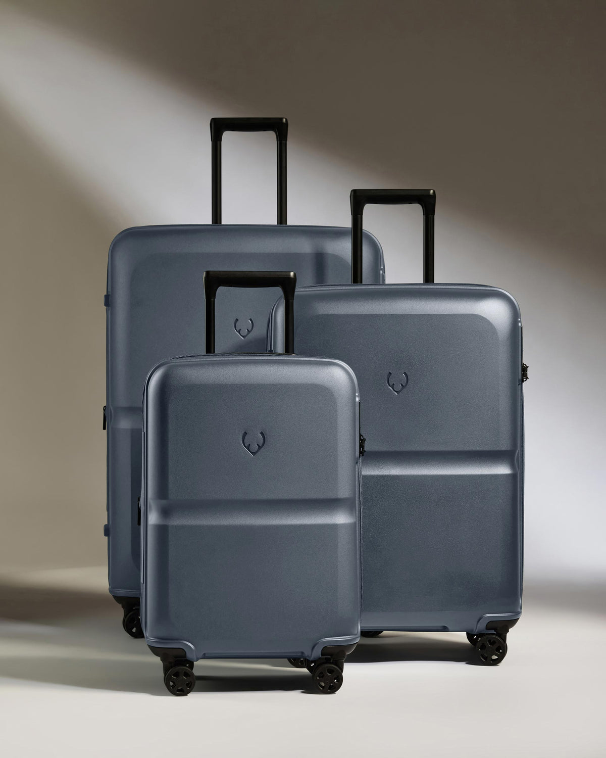 a group of luggage on wheels