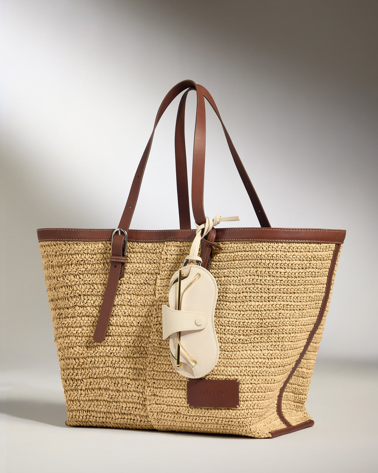 a brown and tan woven bag