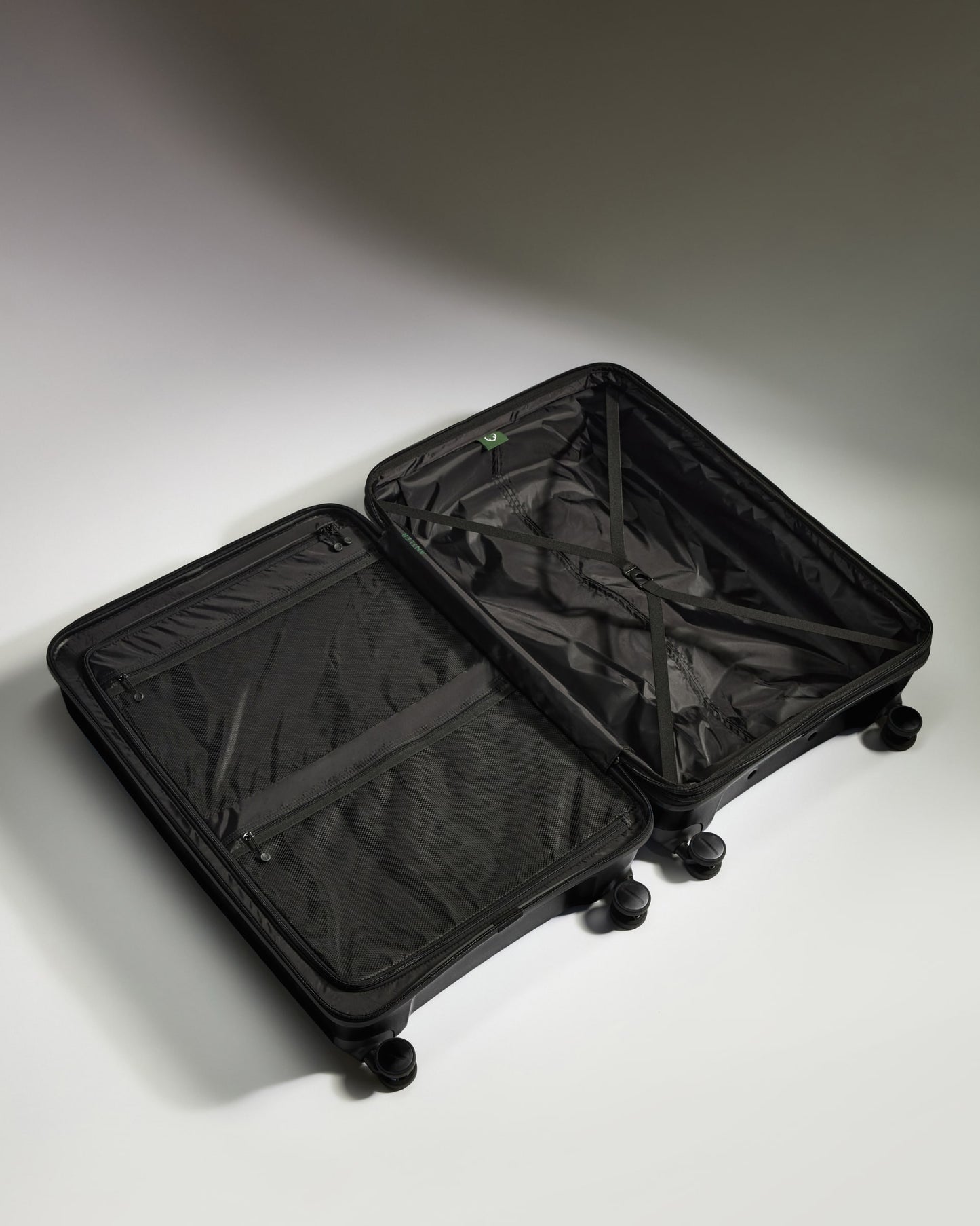 Large Luggage in Black - Logo Stripe
