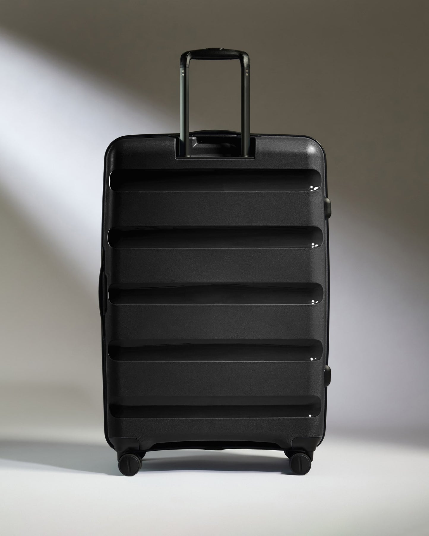 Large Luggage in Black - Logo Stripe