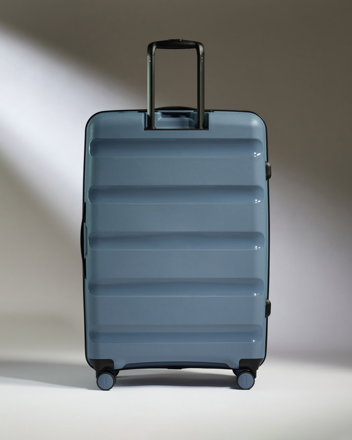 Large Luggage in Light Blue - Logo Stripe
