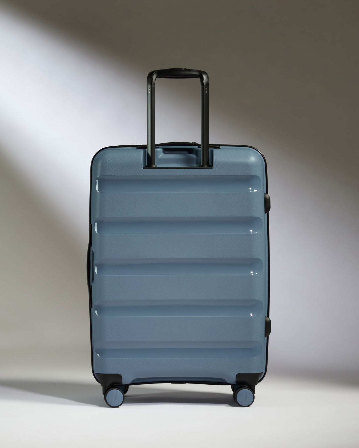 Medium Luggage in Light Blue - Logo Stripe