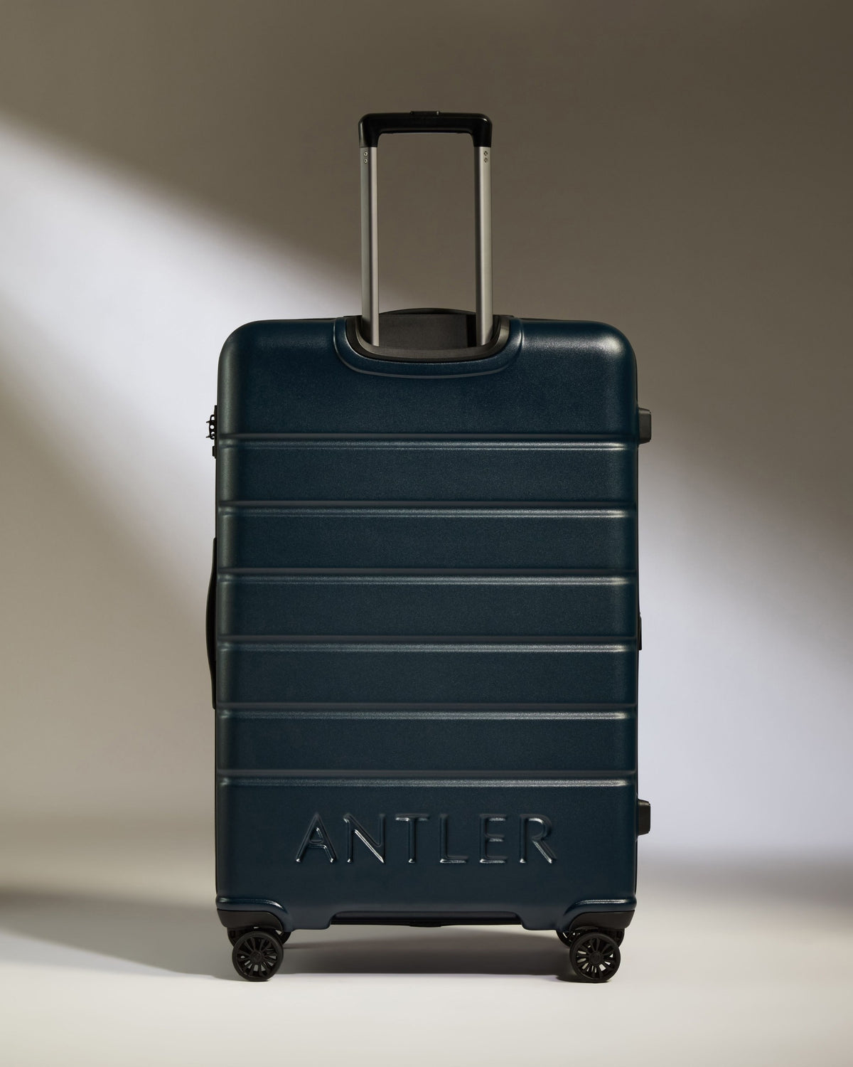 a blue suitcase with wheels