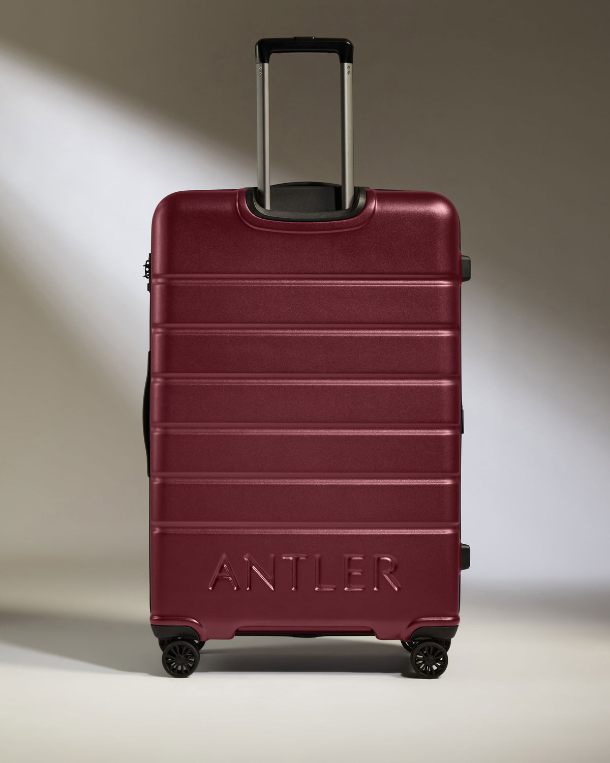 a red suitcase with handle