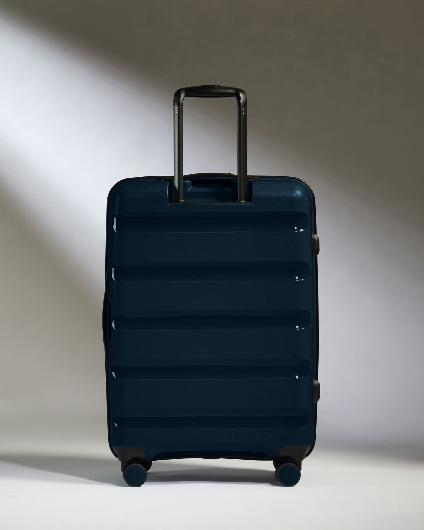 Medium Luggage in Midnight Blue - Logo Stripe