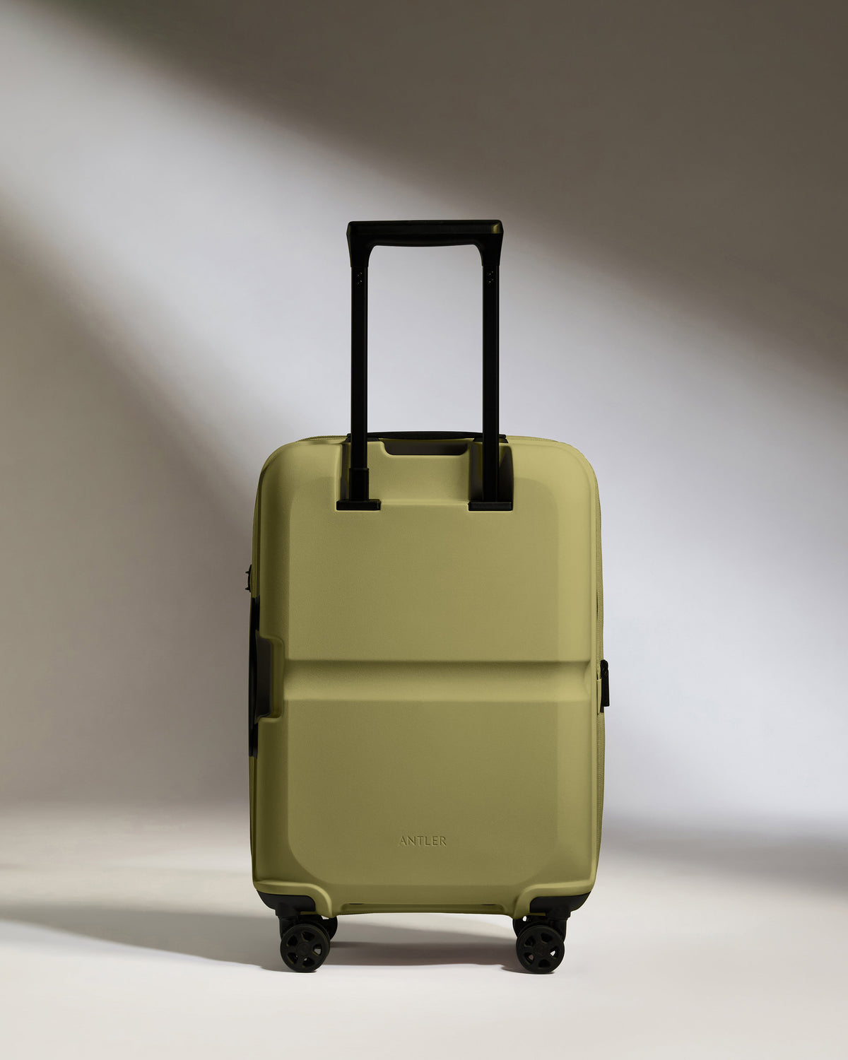 a green suitcase with wheels