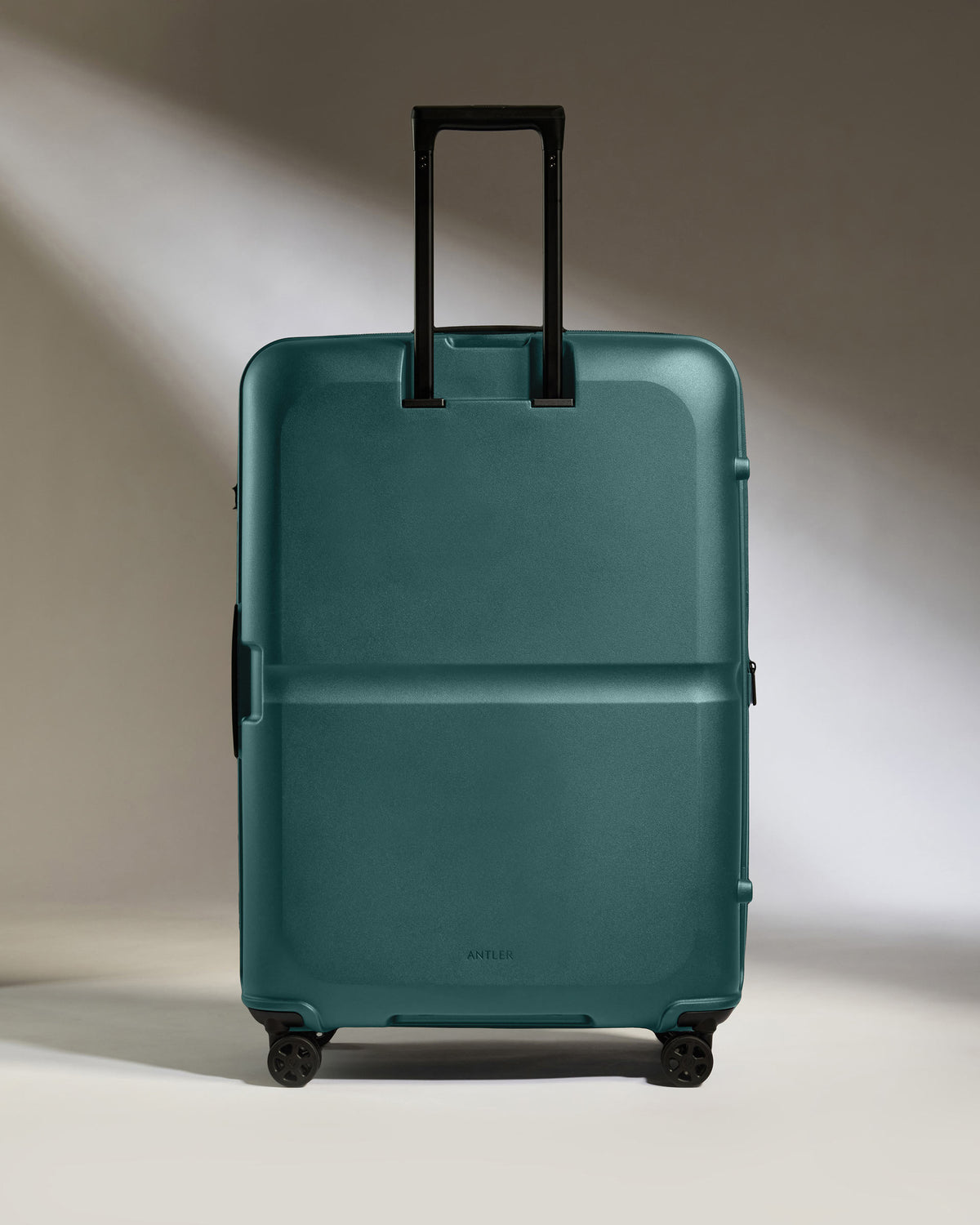 a blue suitcase with black handles