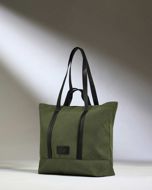 a green bag with black straps
