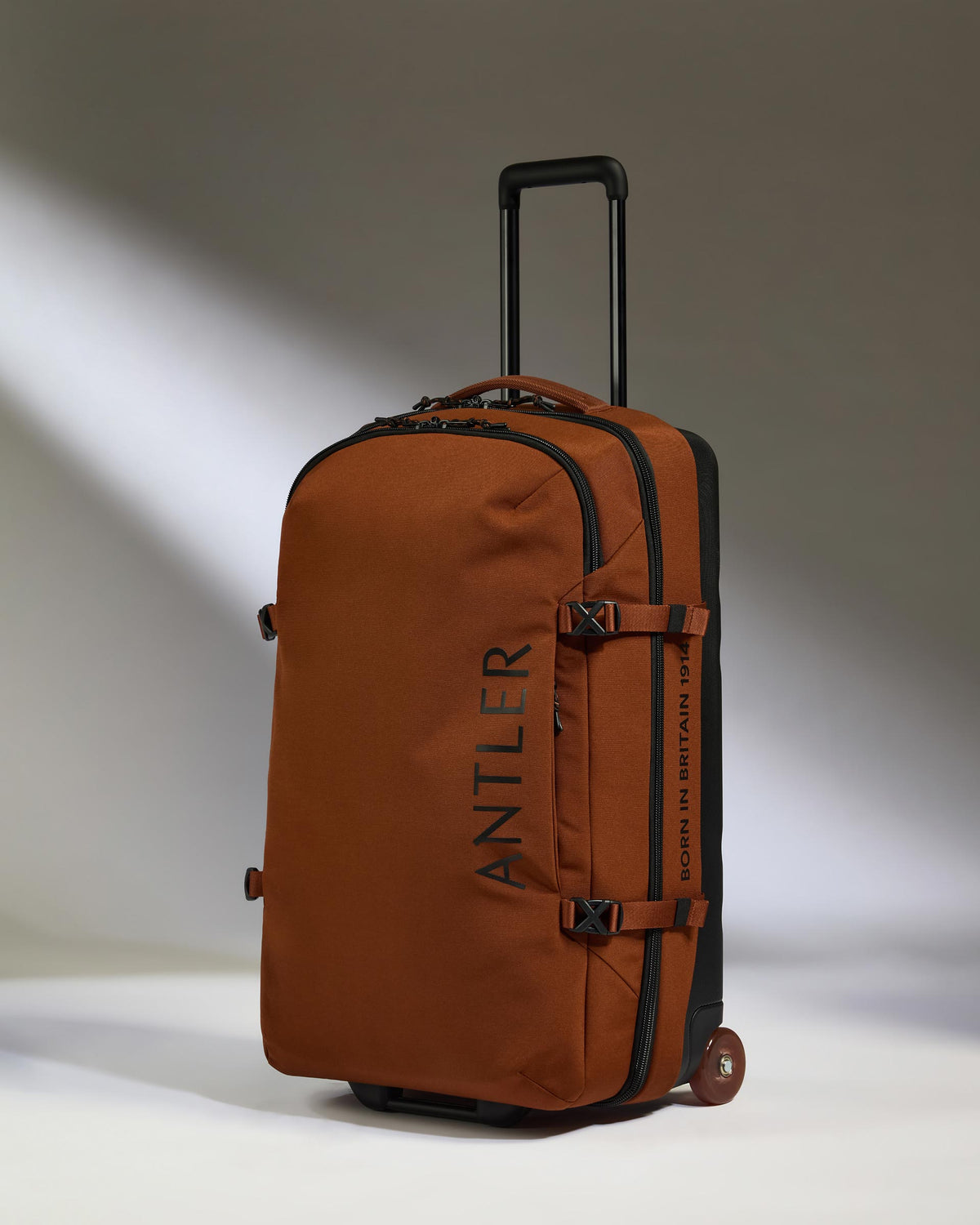 a brown suitcase with wheels