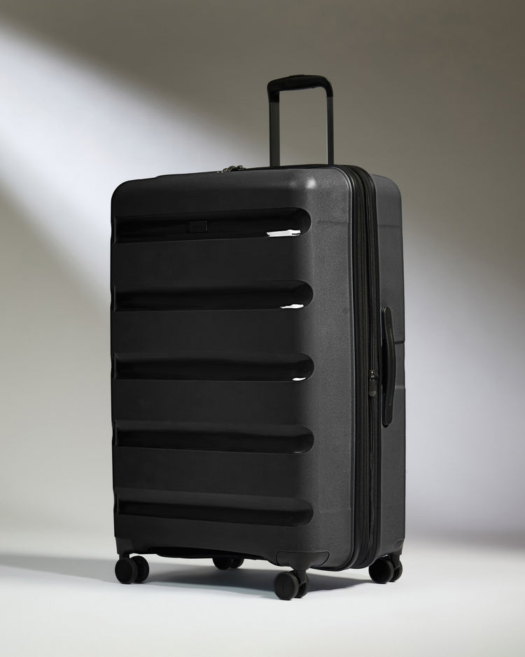 Large Luggage in Black - Logo Stripe