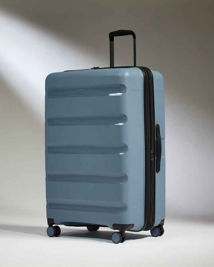 Large Luggage in Light Blue - Logo Stripe