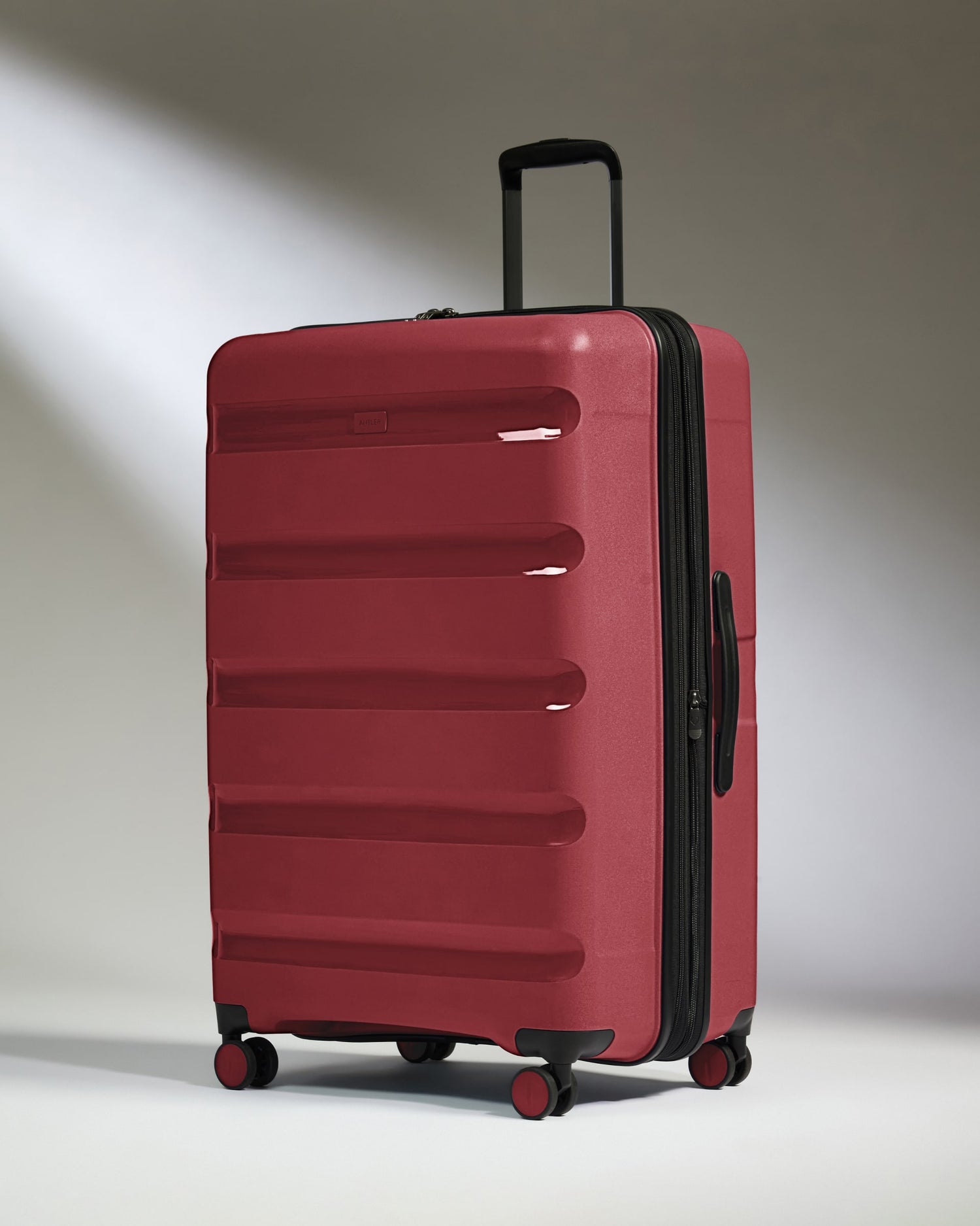 Large Luggage in Soft Red - Logo Stripe