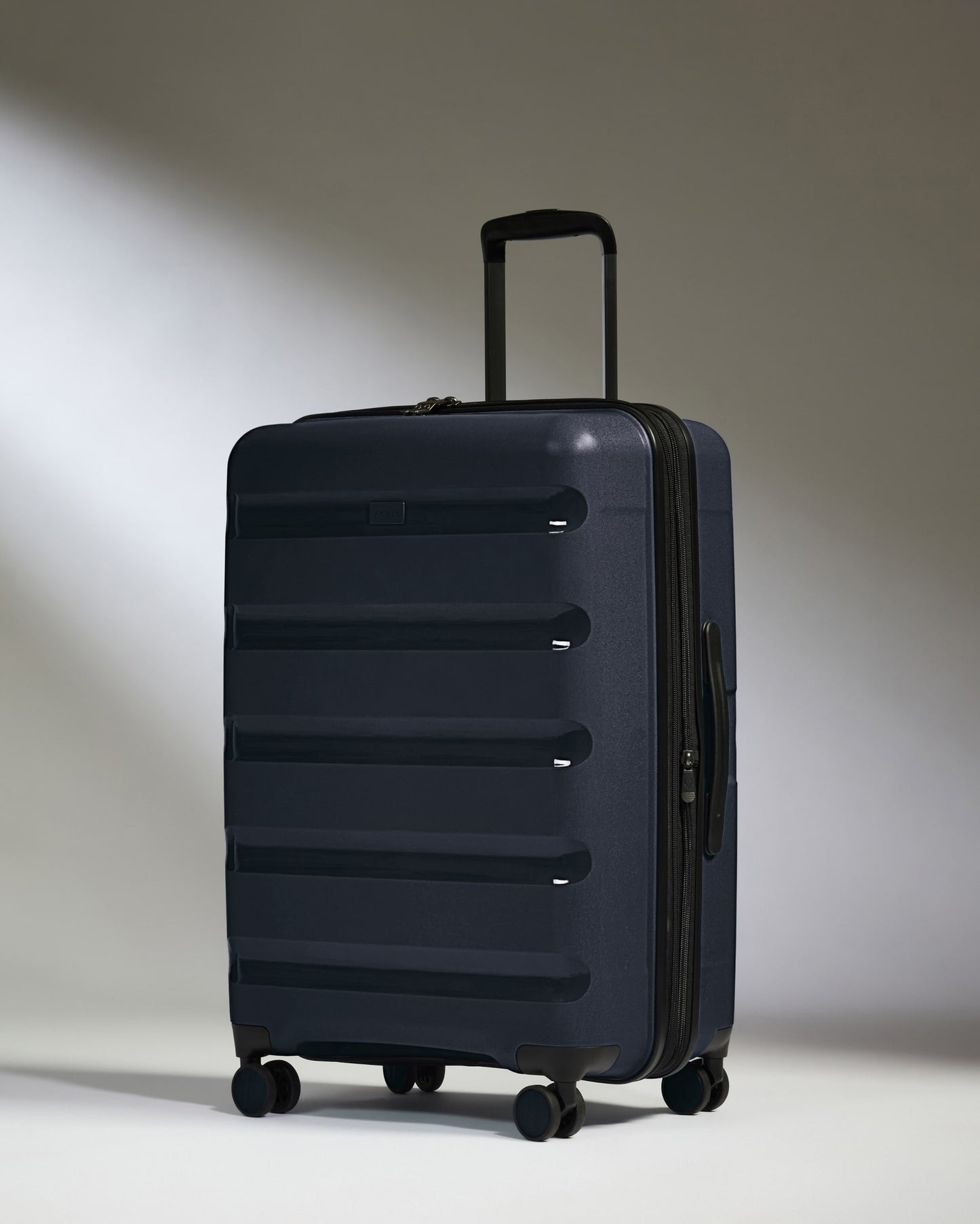 Medium Luggage in Navy - Logo Stripe