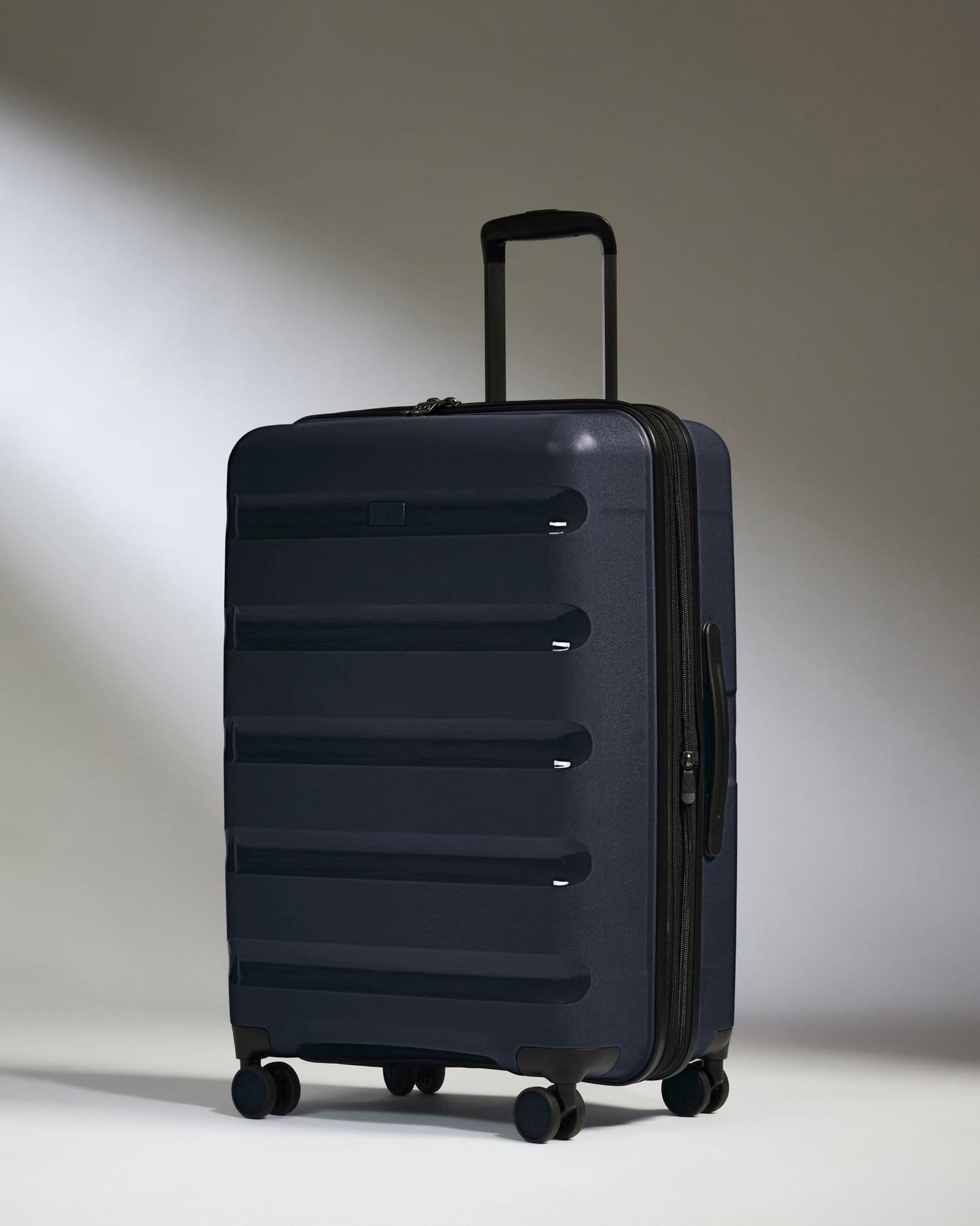 Medium Luggage in Navy - Logo Stripe