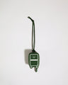 a green luggage tag with a white stripe on it