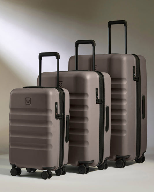 a group of luggage on wheels