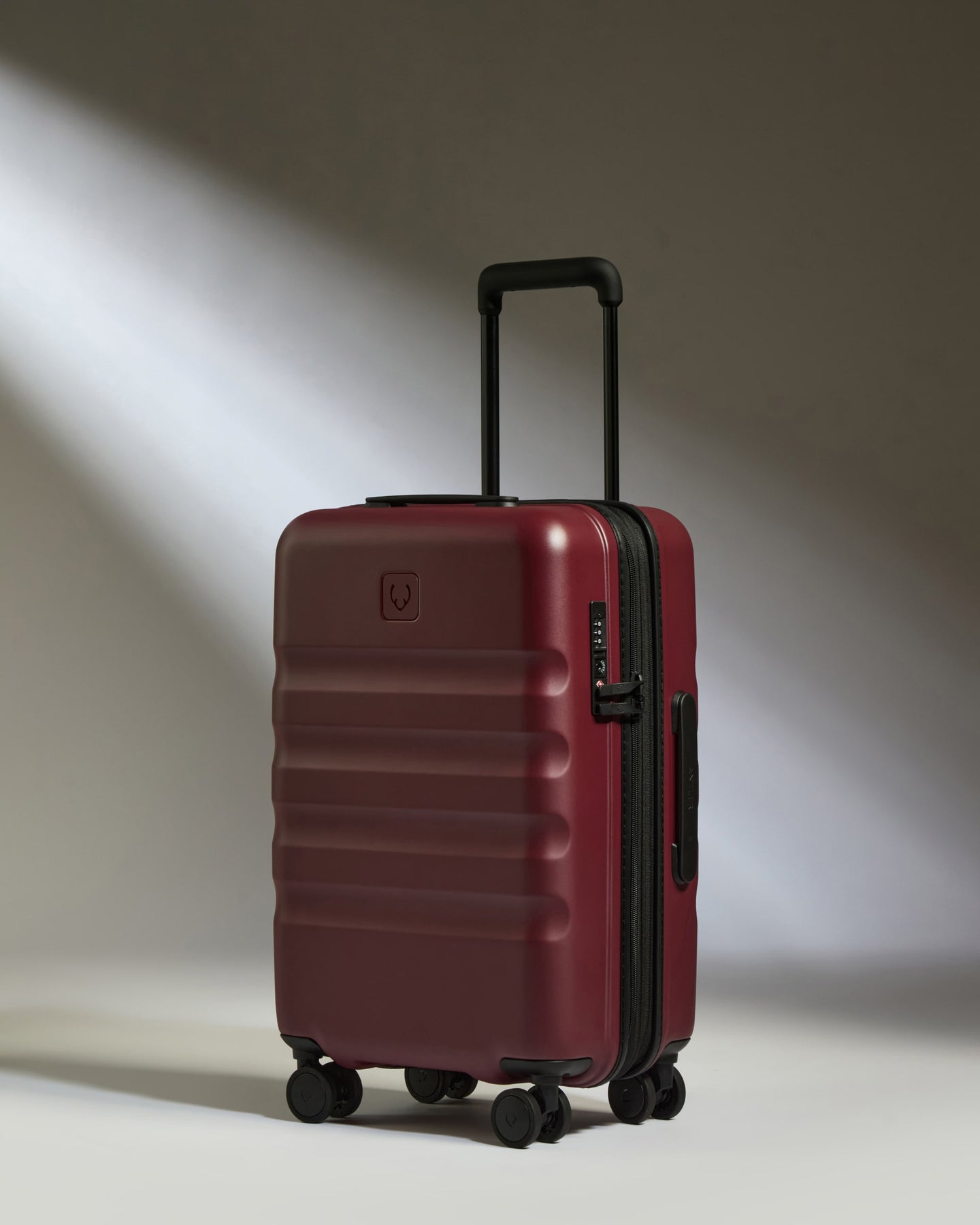 a red suitcase with wheels