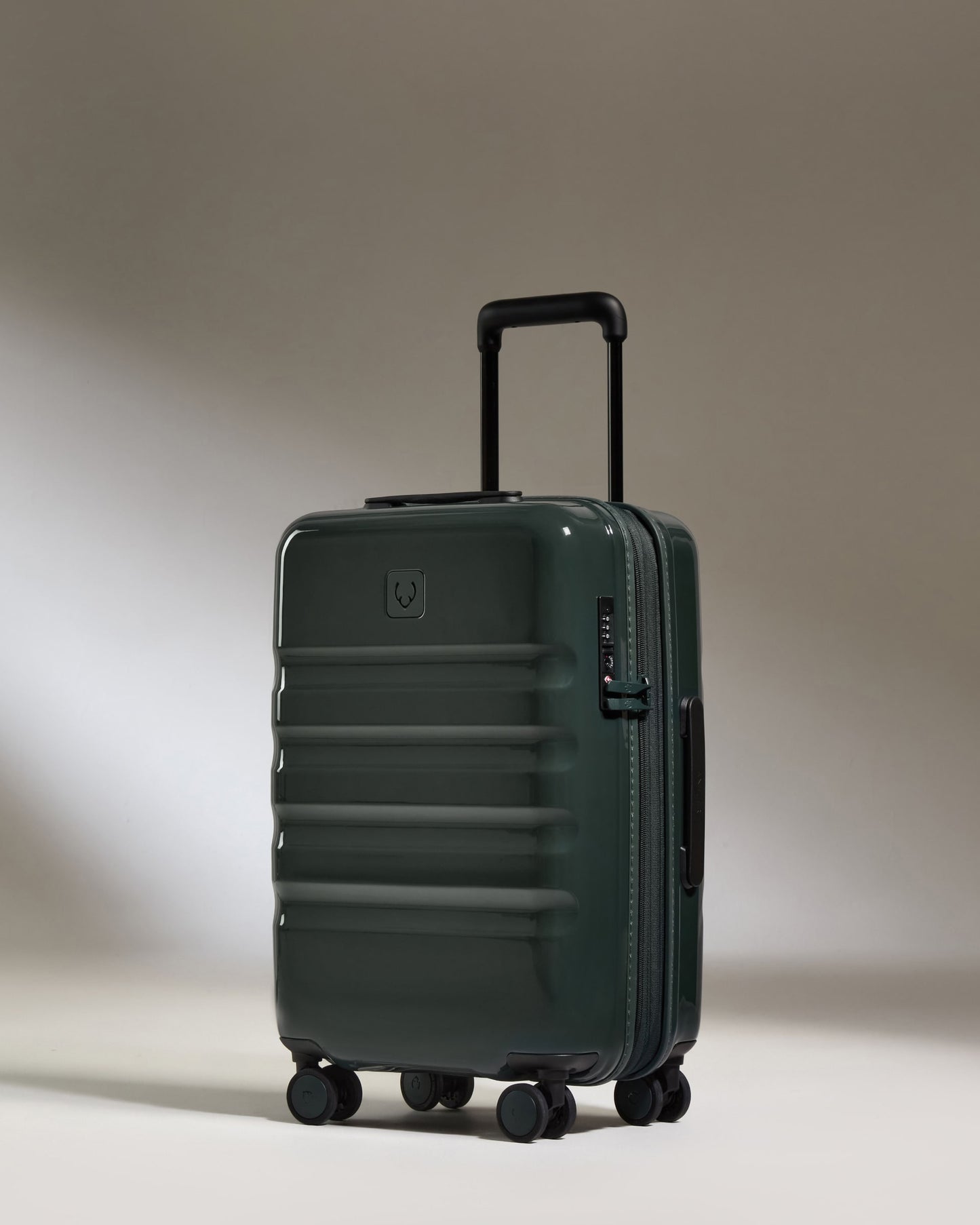 a green suitcase with wheels