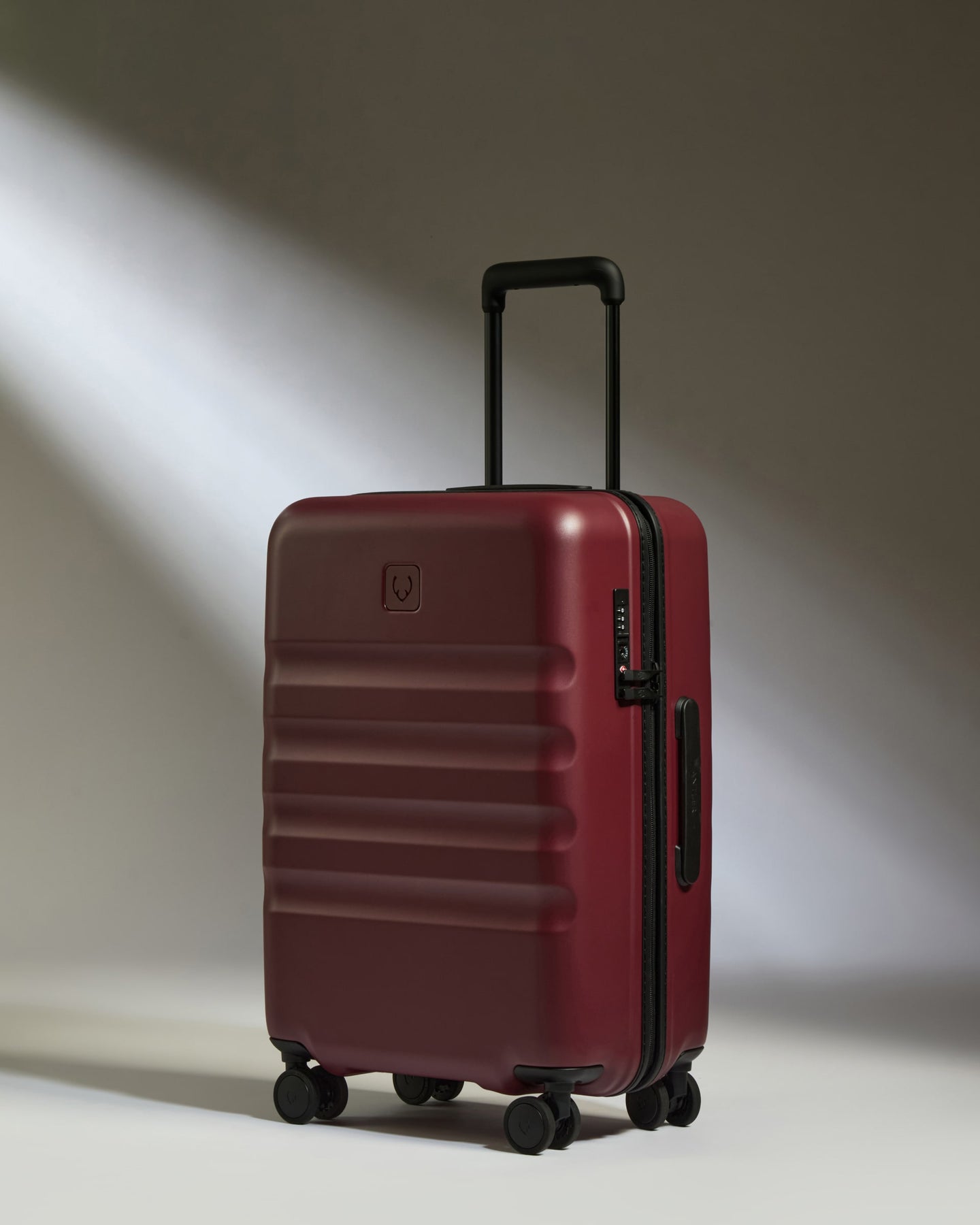 a red suitcase with wheels