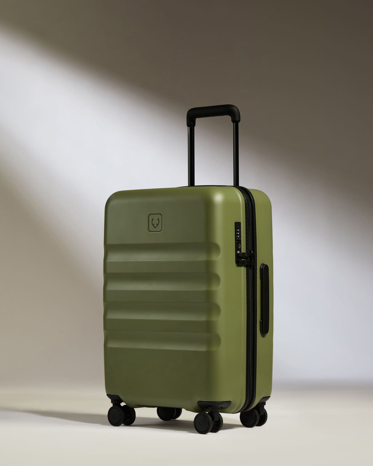 a green suitcase with wheels