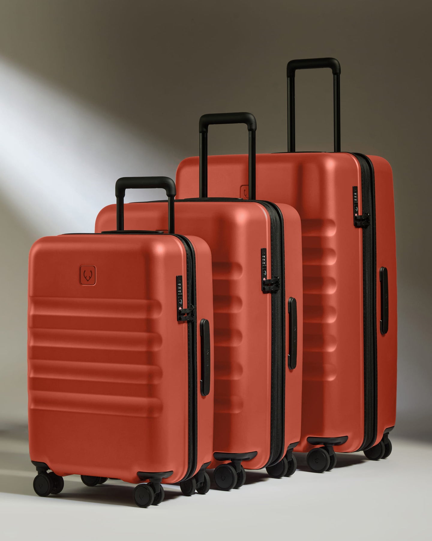 a group of luggage on wheels