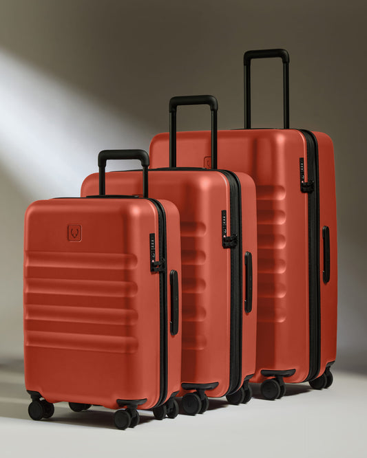 a group of luggage on wheels