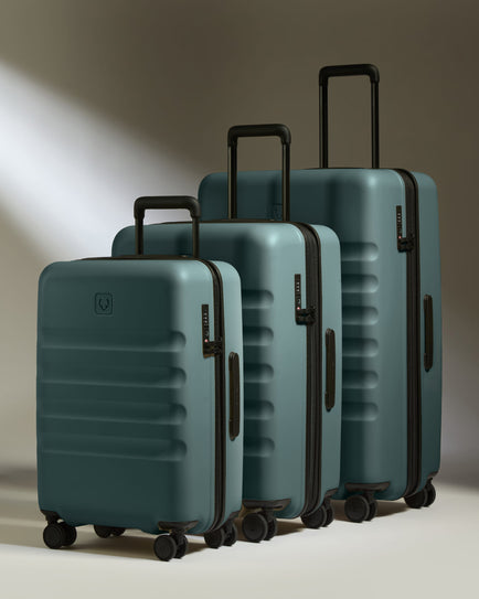 a group of luggage on wheels