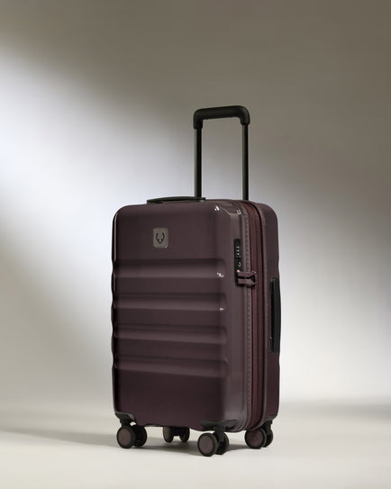 a purple suitcase with wheels