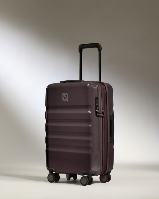 a purple suitcase with wheels