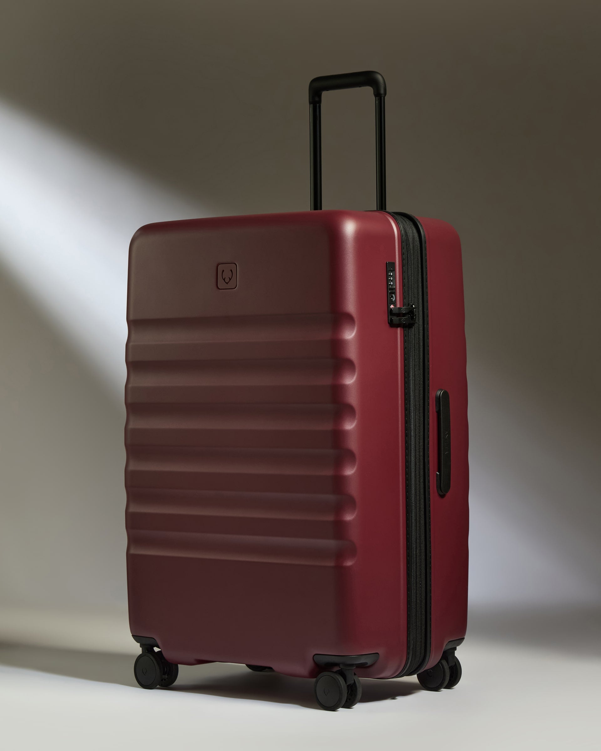 a red suitcase with wheels