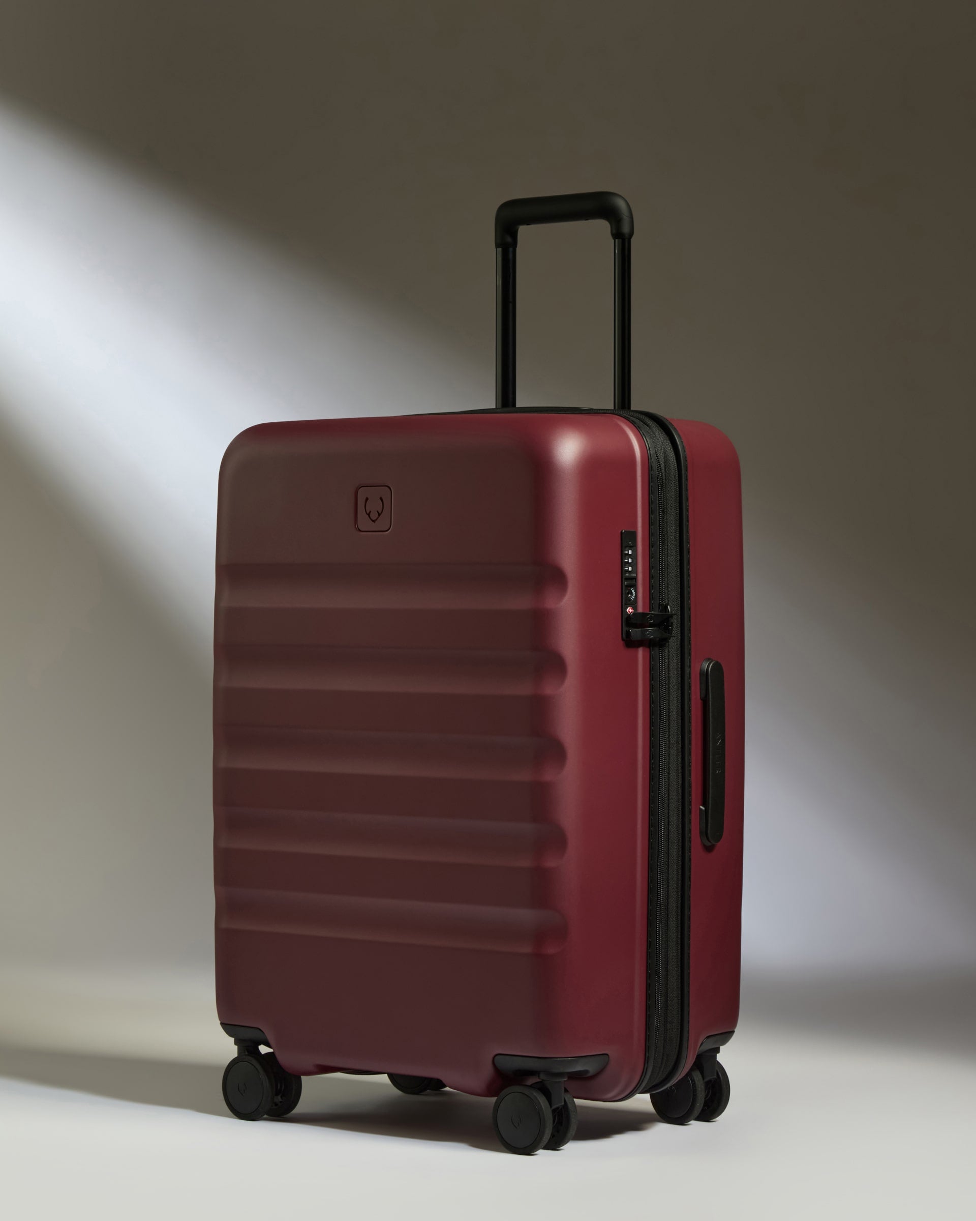 a red suitcase with wheels