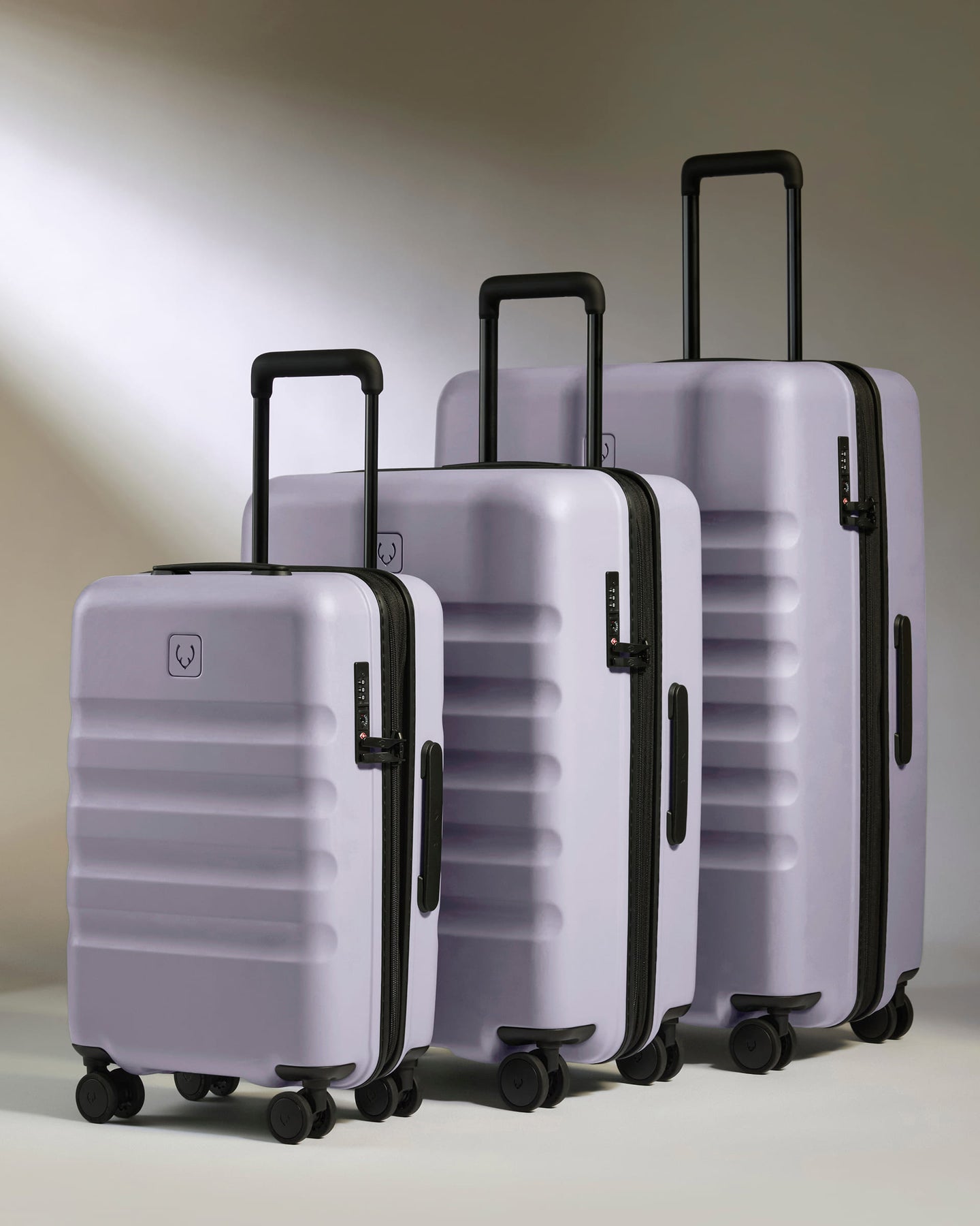 a group of luggage on wheels