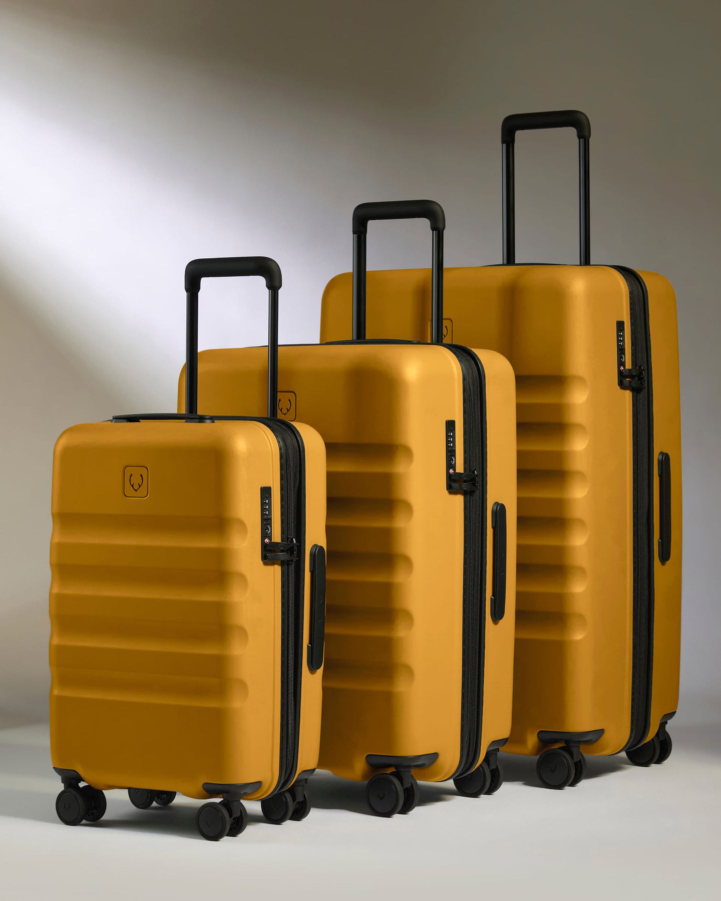 a group of luggage on wheels