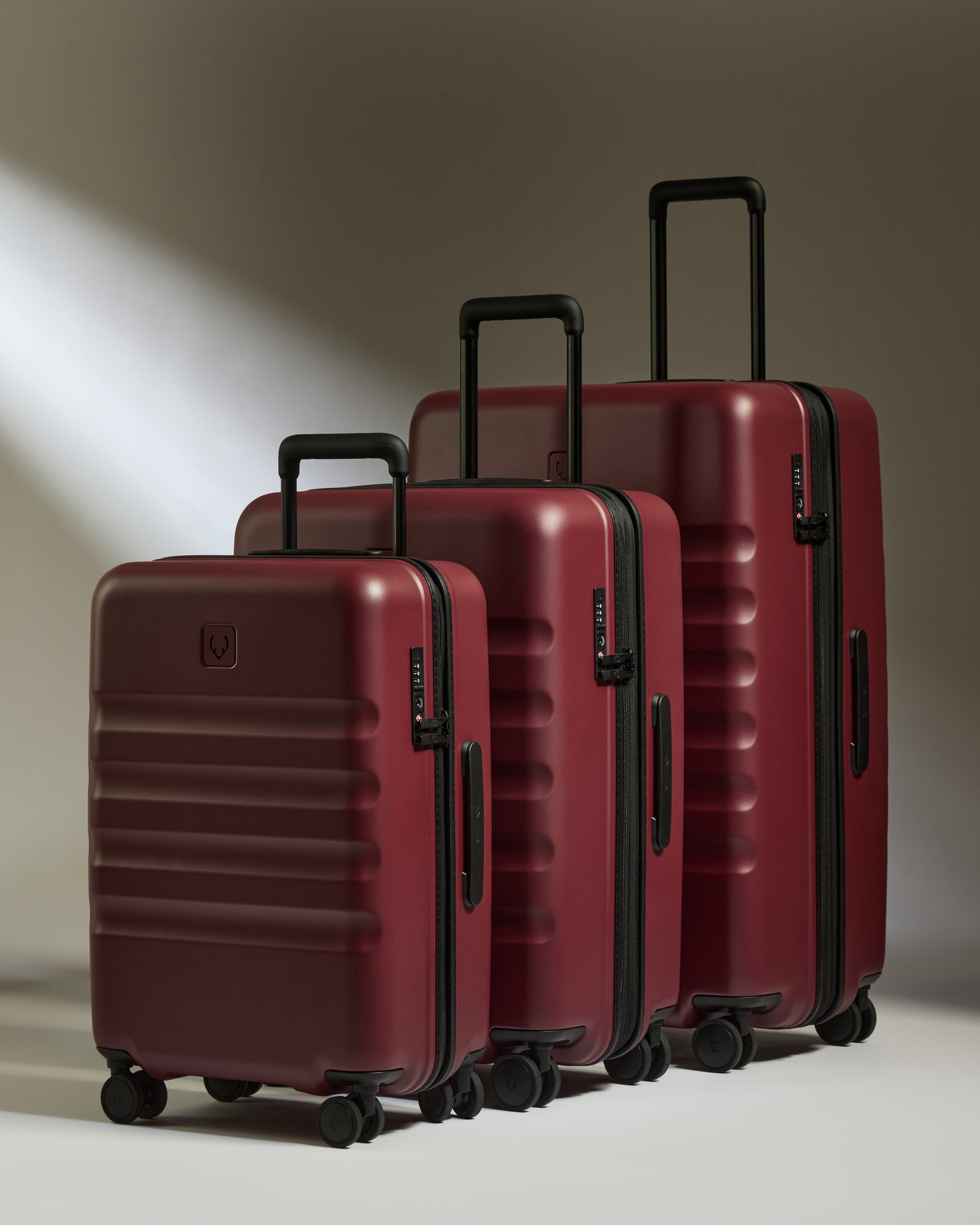 a group of luggage on wheels