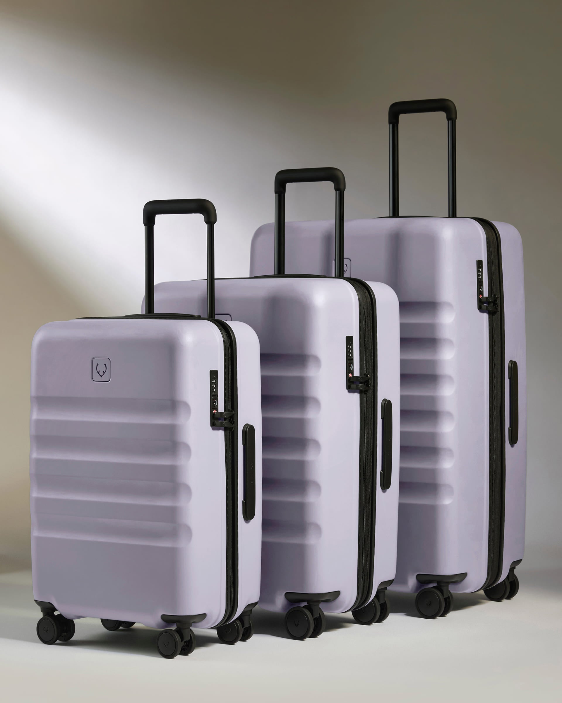 a group of luggage with wheels
