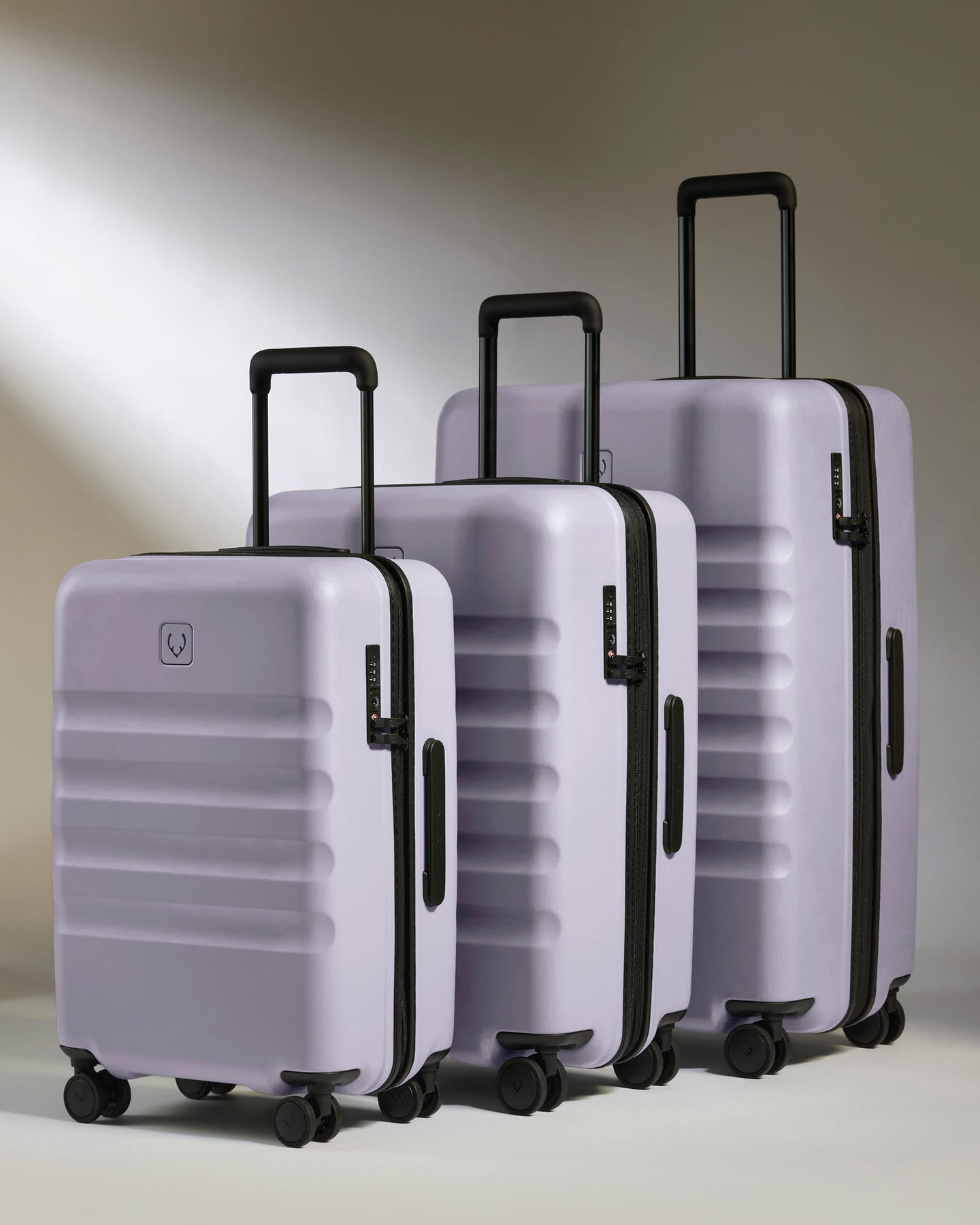 a group of luggage with wheels