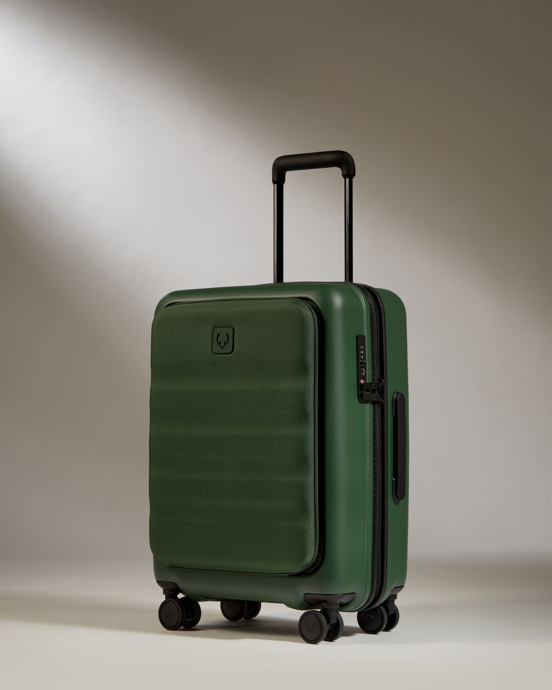 a green suitcase with wheels