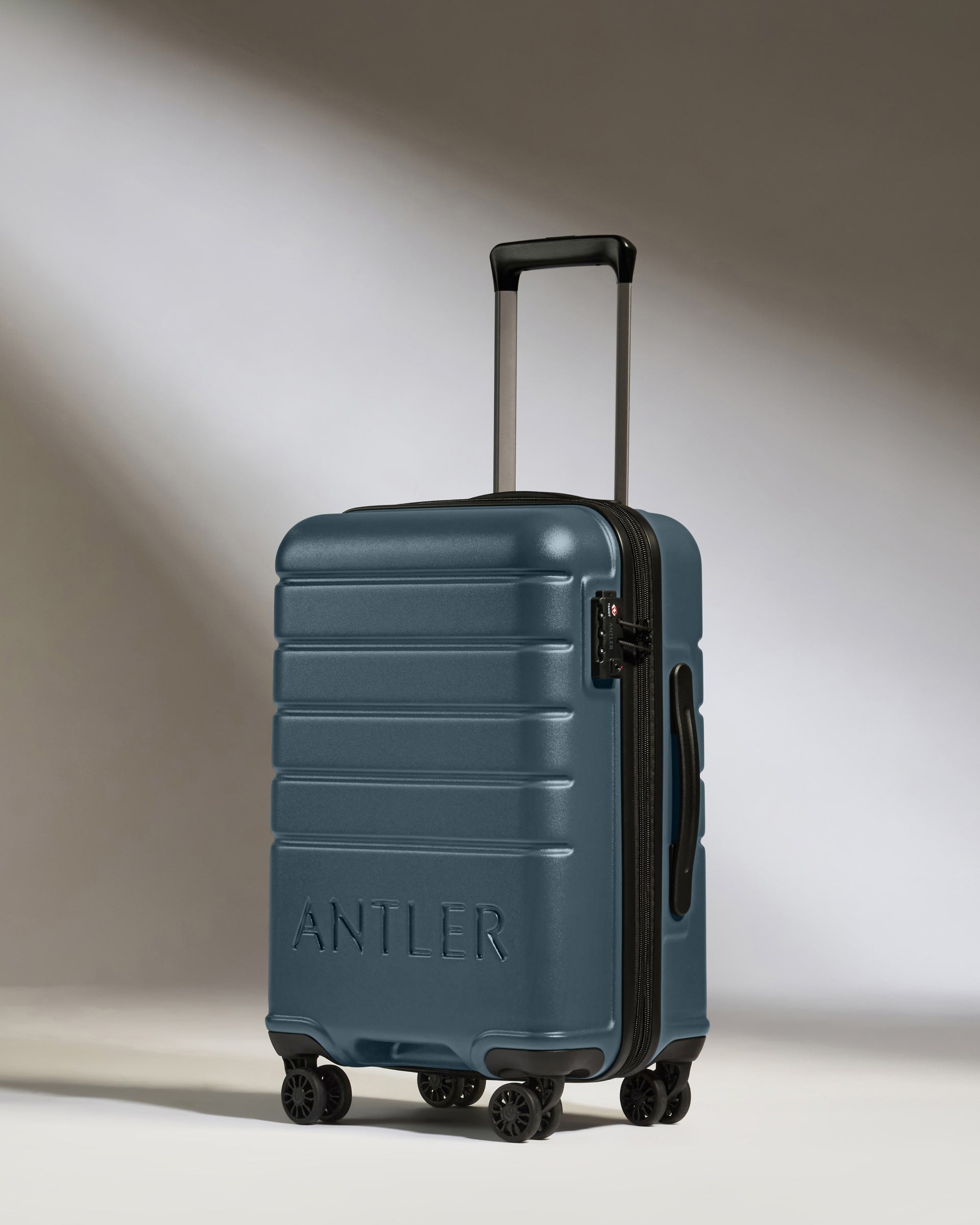 a blue suitcase with wheels