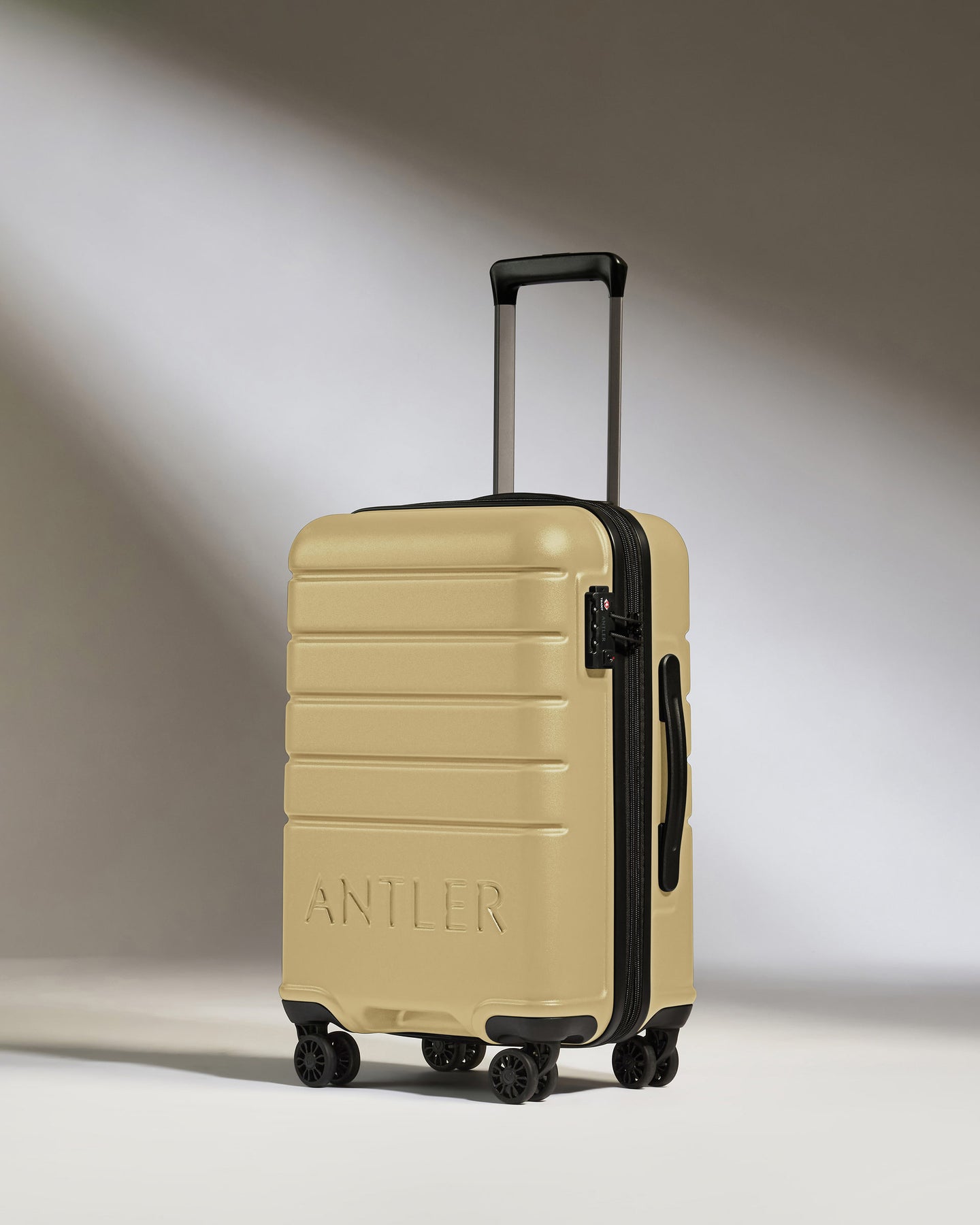 Expandable Carry-On Luggage in Dark Sand - Logo