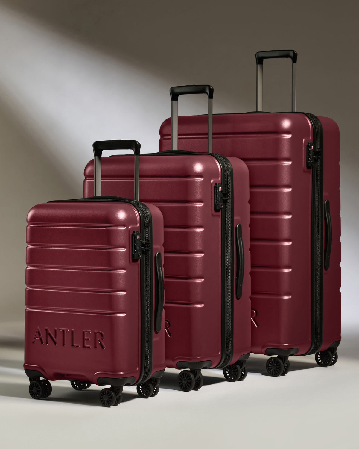 a group of luggage on wheels