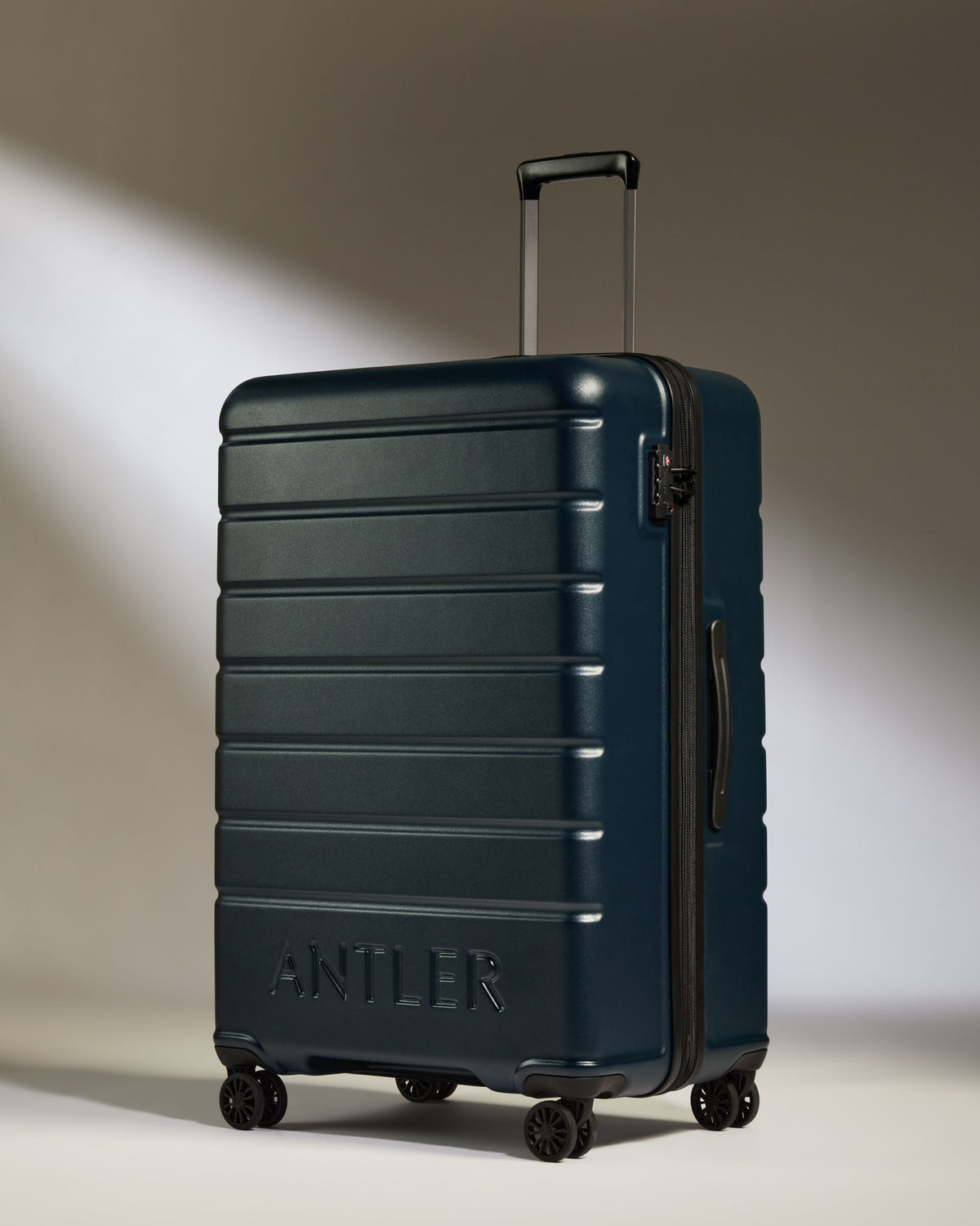 a blue suitcase with wheels