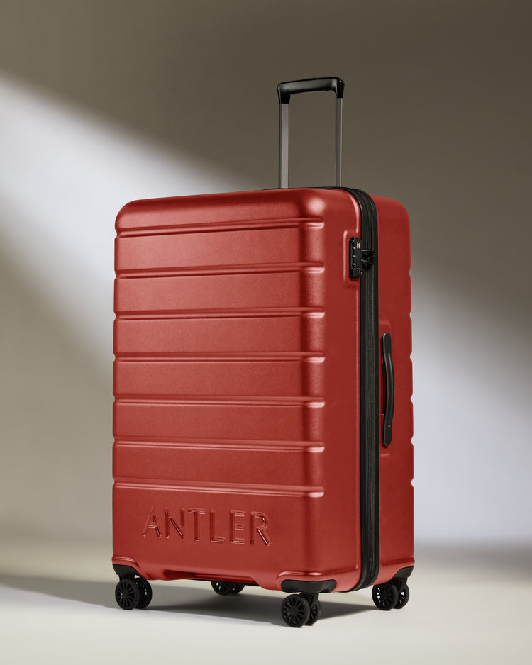 Large Luggage in Red Orange - Logo