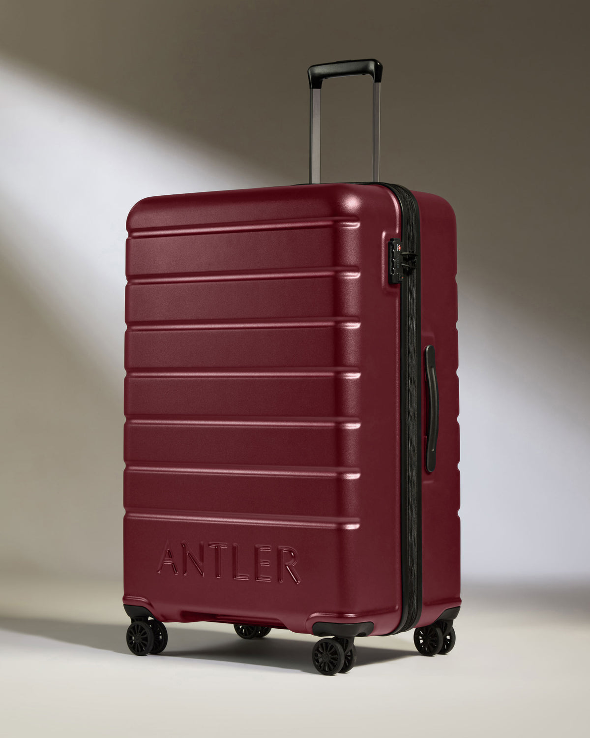 a red suitcase with wheels