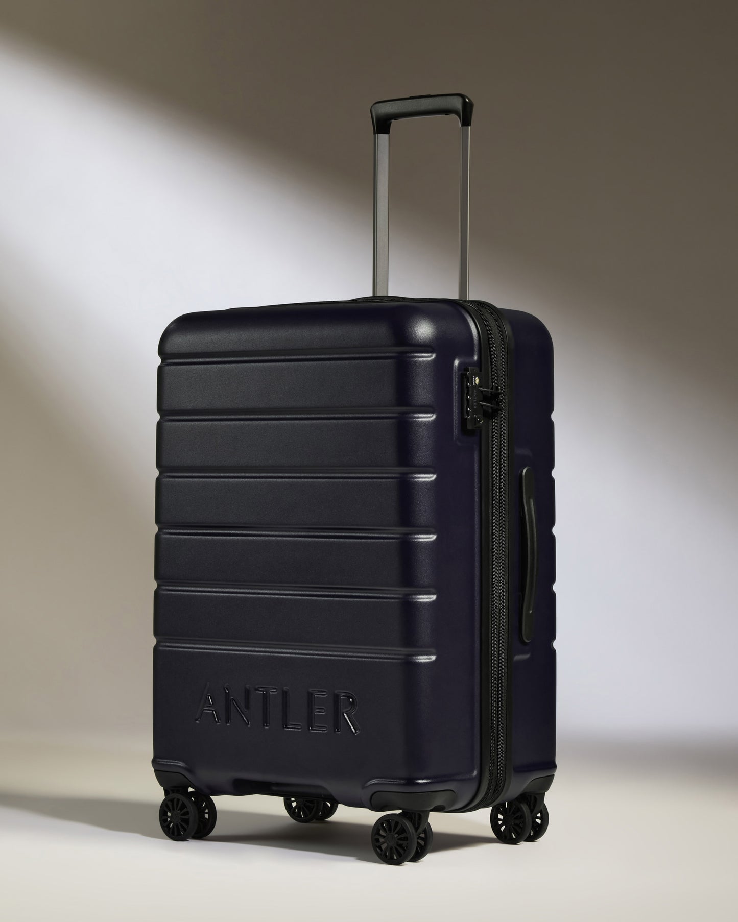 Medium Luggage in Dark Purple - Logo