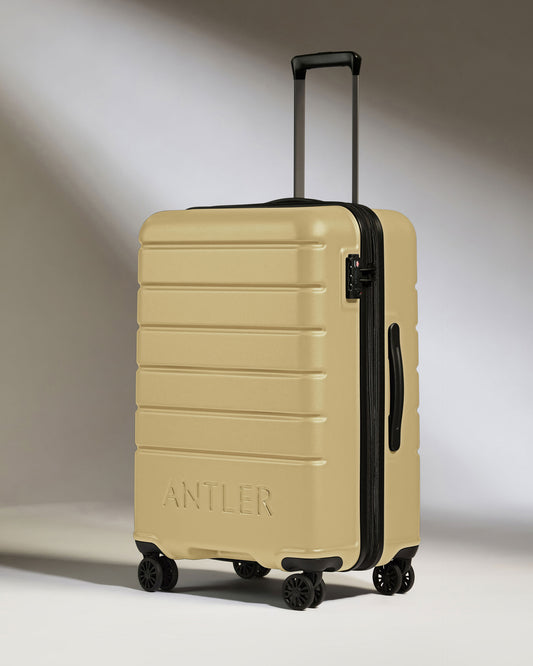 Medium Luggage in Dark Sand - Logo