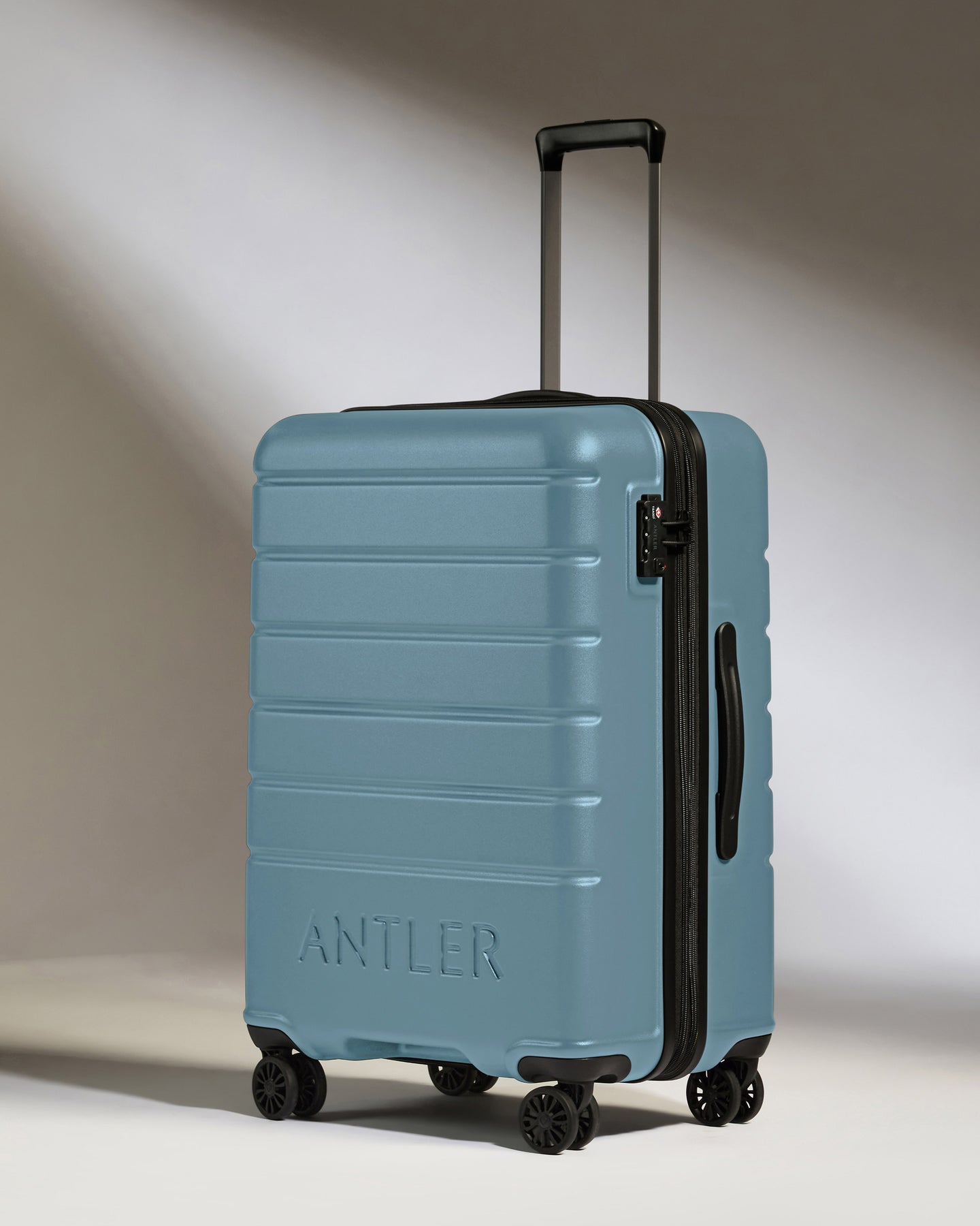 Medium Luggage in Light Blue - Logo