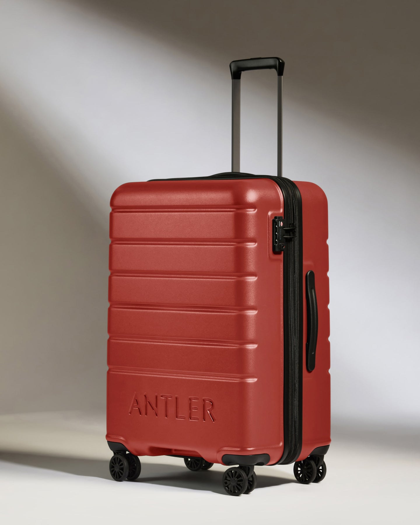 Medium Luggage in Red Orange - Logo